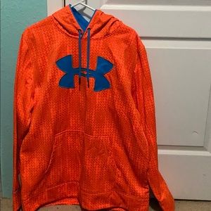 A orange and blue mens Under Armour sweatshirt